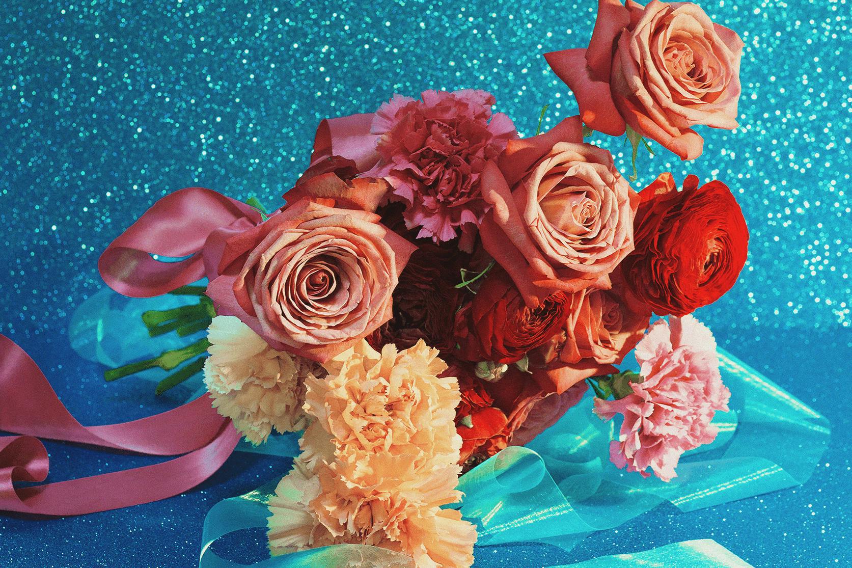 A bouquet with a sparkly blue background.